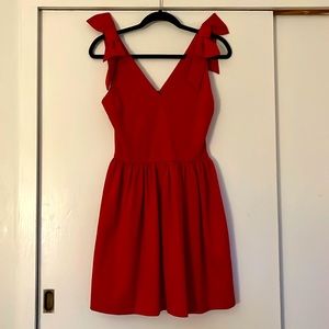 Rich red party dress! Fit and flare, twirly skirt, bows at shoulder. Aqua size M
